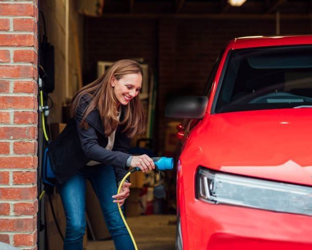 Woman plugging EV